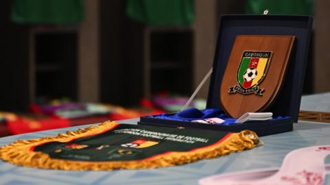 A Cameroon pennant and shield in the dressing room