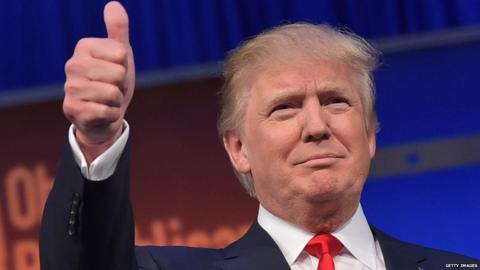 Republican presidential candidate Donald Trump gives a thumbs-up.