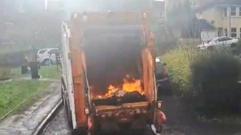 Bin truck on fire