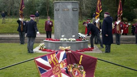 Wreaths are laid at a memorial to mark the bombing of the 1972 HQ 16th Independent Parachute Brigade Officers" Mess