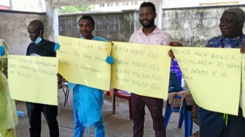 People holding signs