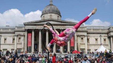 Acrobats perform at the Feast of St George celebrations in Trafalgar Square
