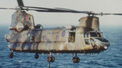 The Bravo November helicopter flying over the sea