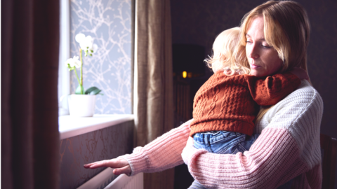 Woman and child near radiator