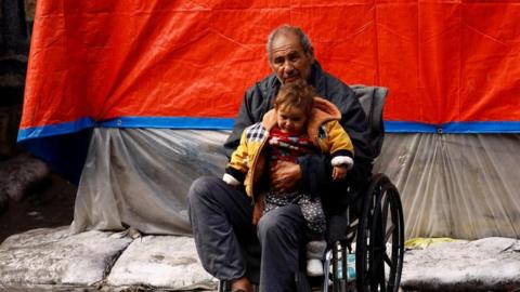 Man and child in Rafah