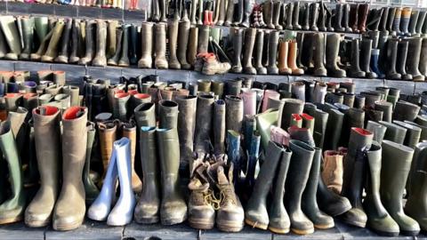 Thousands of wellies placed in front of the Welsh parliament