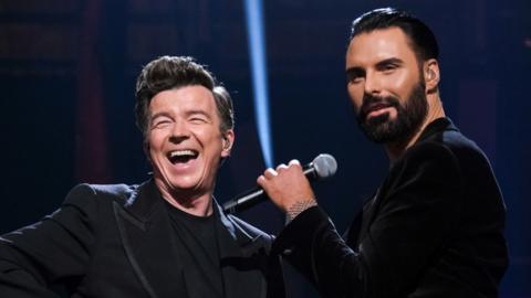 Rick Astley and Ryland Clark on stage