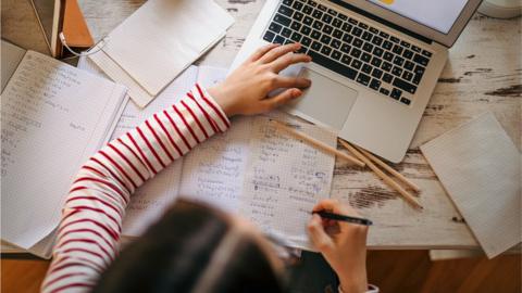 A child doing school work at home