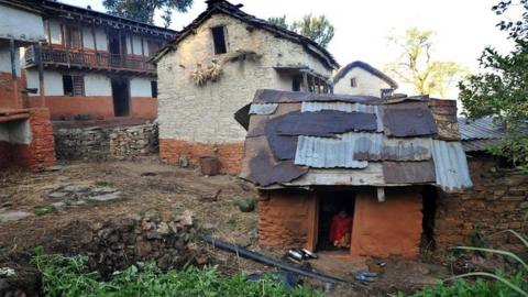 In this file photo taken on November 23, 2011 a Nepali teenage girl sits inside a "chhaupadi house" in Achham village, some 800km west of Kathmandu,