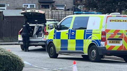 Two police cars on a street