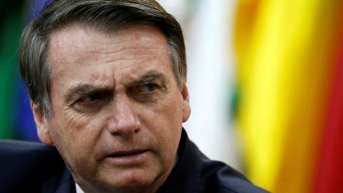 Brazil's President Jair Bolsonaro looks on during a National Soccer Day Ceremony in Brasilia