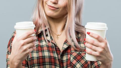 Woman choosing between drinks