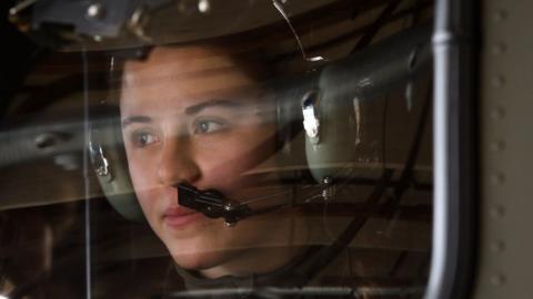 A female soldier in a helicopter at the Swiss Air Force Base of Payerne.