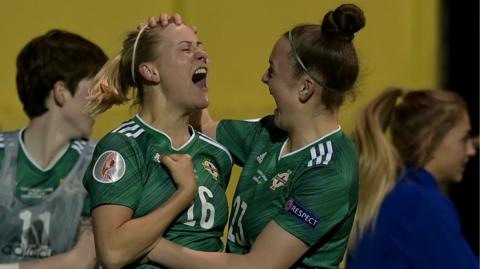 Nadene Caldwell celebrates with Kerry Beattie