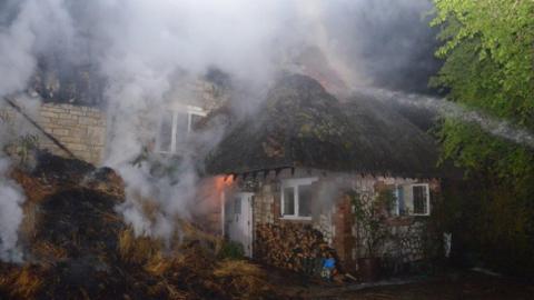 Thatched cottage fire