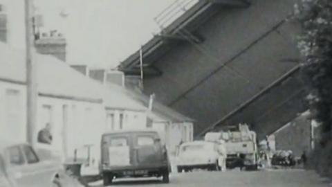 bridge collapsed by houses