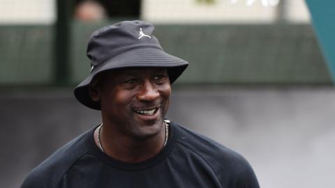 This file photo taken on June 14, 2015 shows US former basketball player Michael Jordan he attends the inauguration of a street basketball court in the Haies sports ground in Paris.
