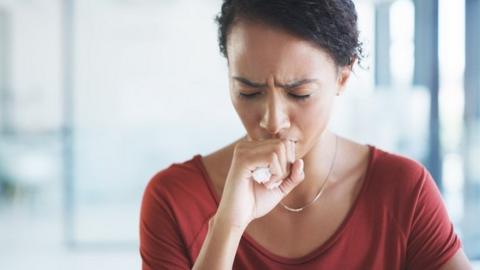 Woman coughing