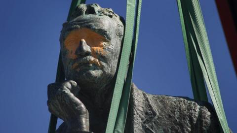 A defaced statue of Cecil Rhodes is removed from the University of Cape Town in 2015