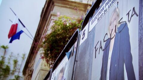 A Marine Le Pen poster defaced with the word "fascista" in France