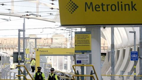 A general view of police officers at Manchester Victoria Metrolink station, in Manchester, north west England, 01 January 2019,