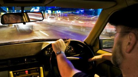 Stock image of a driver in a car