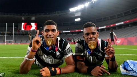 Meli Derenalagi, left, and Bolaca Napolioni of Fiji with their gold medals at the Tokyo Stadium during the 2020 Olympic Games