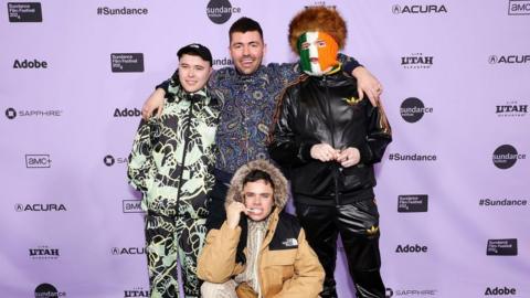 Kneecap members with director Rich Peppiatt on the red carpet at Sundance Film Festival 2024