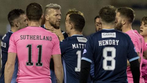 Raith Rovers' Iain Davidson (third left) is confronted