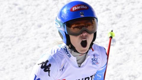 Mikaela Shiffrin celebrates winning her giant slalom world title