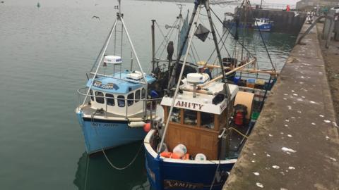 The two boats are tied up at Clogherhead Harbour in County Louth