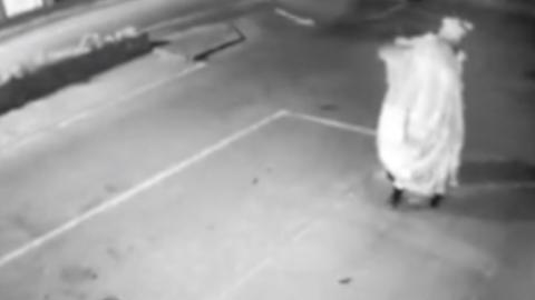 CCTV shows a person removing the postbox topper