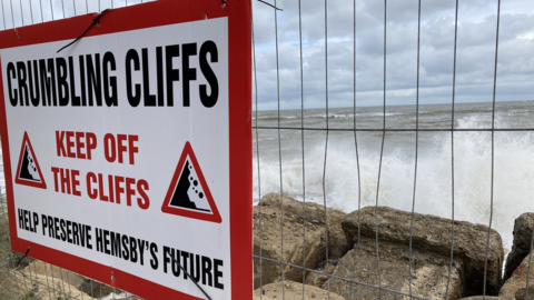 A warning sign telling people to keep off the cliffs at Hemsby, Norfolk
