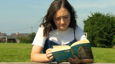 Gwenllian Griffiths reading a book