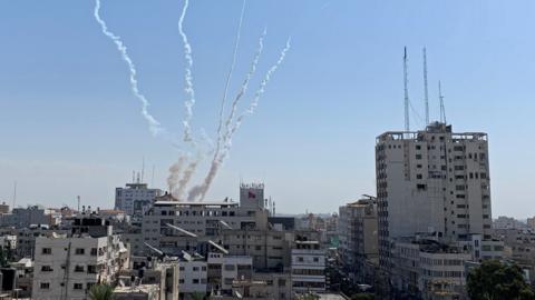 Trails of smoke above Gaza after a rocket launch on 14 November 2019