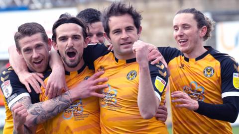 Matty Dolan (second right) celebrates with Newport team-mates