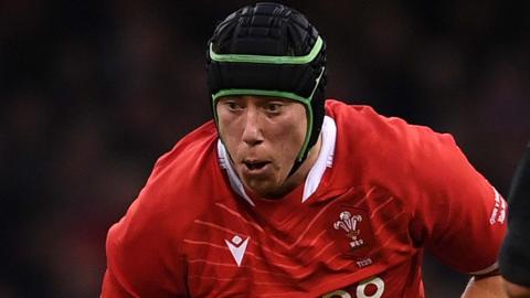 Adam Beard in action for Wales