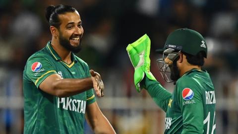 Pakistan's Imad Wasim and Mohammad Rizwan celebrate a wicket against Scotland in the ICC Men's T20 World Cup