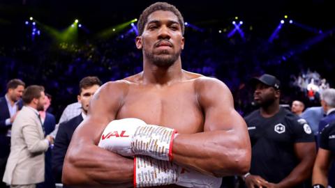 Heavyweight champion Anthony Joshua poses with his arms crossed after beating Andy Ruiz Jr in Saudi Arabia