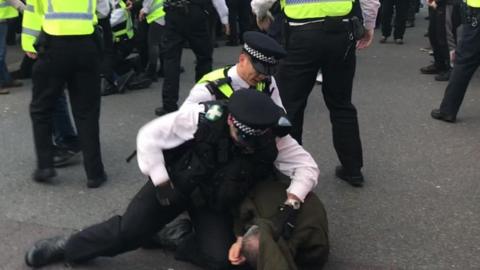 Police medic and protestor