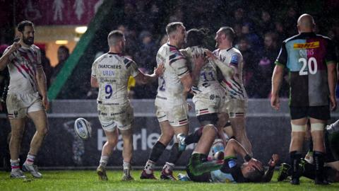 Bristol celebrate scoring a try against Harlequins