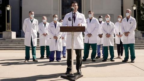 U.S. Navy Commander Dr. Sean Conley, the White House physician, flanked by other doctors