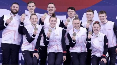 The GB all-around team with their medals