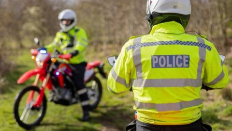 Police on off-road bikes