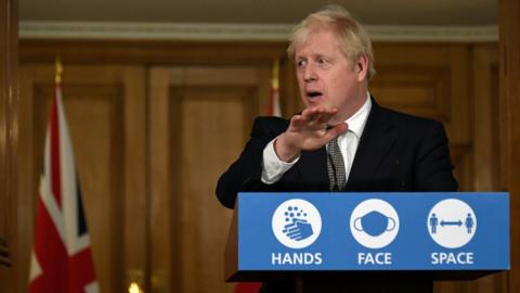 Britain's Prime Minister Boris Johnson speaks during a press conference in 10 Downing Street on October 31, 2020 in London, England.