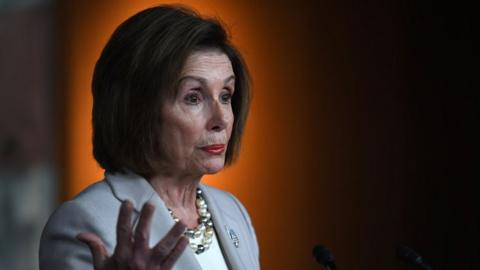 Nancy Pelosi gestures as she gives a speech in Washington DC