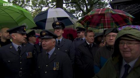 mourners at the funeral