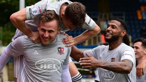 James Scott celebrates a goal at Wycombe