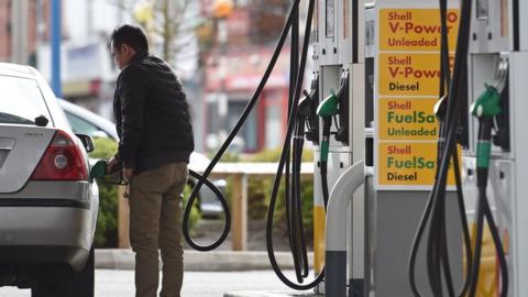 Man at petrol pump