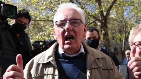 Former post office worker Noel Thomas, who was convicted of false accounting in 2006, celebrates with his daughter Sian outside the Royal Courts of Justice, London, after having his conviction overturned by the Court of Appeal.